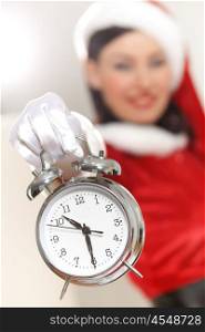 christmas girl in santa hat. excited girl with santa hat holding clock. illustration