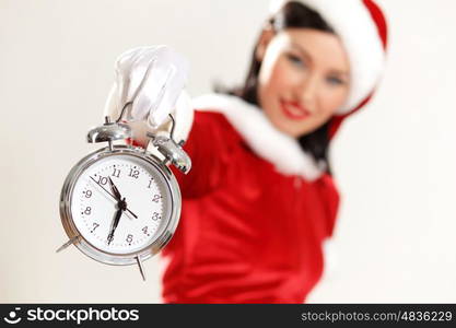 christmas girl in santa hat. excited girl with santa hat holding clock. illustration