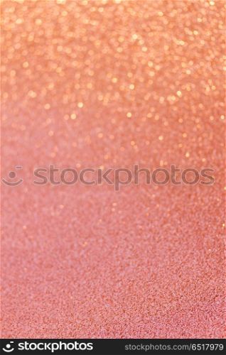 Christmas glittering background. Christmas abstract glittering defocused pink background with bokeh lights