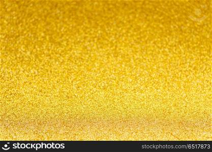 Christmas glittering background. Christmas festives glittering defocused golden background with bokeh