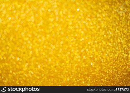 Christmas glittering background. Christmas holiday festive glittering defocused golden background with bokeh