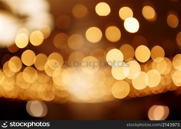 Christmas gold background. Festive abstract background with bokeh defocused lights.. Christmas gold background. Festive abstract background with bokeh defocused lights