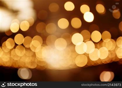 Christmas gold background. Festive abstract background with bokeh defocused lights.. Christmas gold background. Festive abstract background with bokeh defocused lights