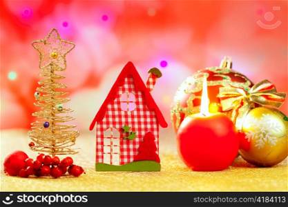 Christmas golden tree and red vichy house in blurred lights