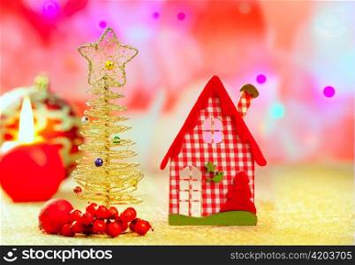 Christmas golden tree and red vichy house in blurred lights