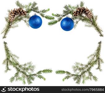 christmas greeting card frame - green tree branches with cones and blue balls on white background