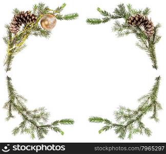 christmas greeting card frame - spruce tree branches with cones and gold ball on white background