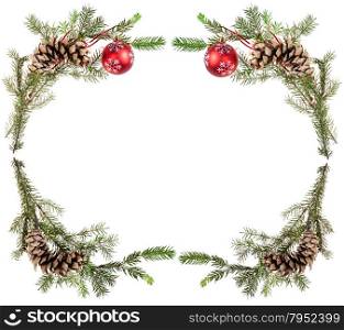 christmas greeting card frame - spruce tree twigs with cones and red balls on white background