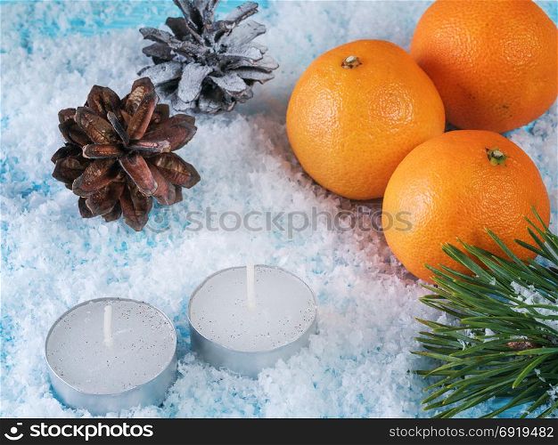 Christmas greeting card. Oranges, cone. Christmas card with oranges and two candles