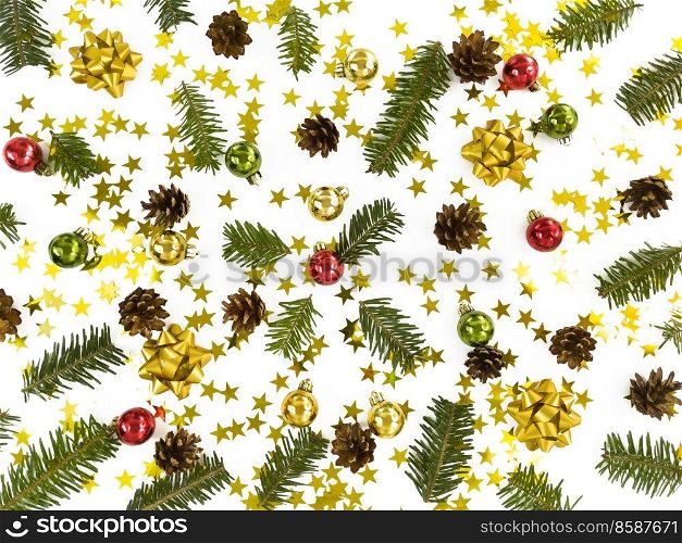 Christmas greeting card. Scattered fir tree branches, baubles, stars, cones and bowes on white background. Simple winter holiday flat lay.. Christmas greeting card. Scattered fir tree branches, baubles, stars, cones and bowes on a white background. Simple winter holiday flat lay.