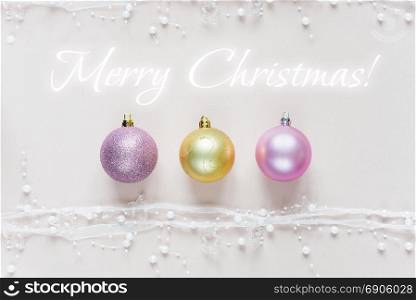 Christmas greeting card with Christmas balls on a pink background. Flat lay composition, websites, social media, magazines, bloggers, artists etc. Christmas wallpaper