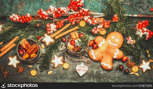 Christmas greeting card with ginger man, mulled wine and festive decoration on dark vintage background, top view, banner
