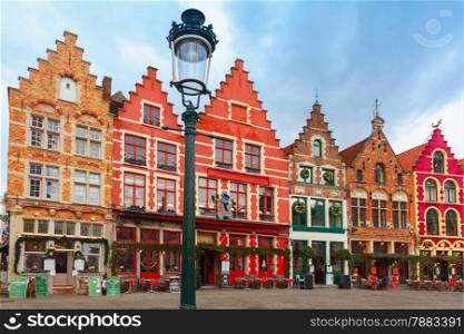 Christmas Grote Markt square in the beautiful medieval city Brugge at morning, Belgium.