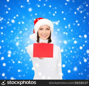 christmas, holdays, people, advertisement and sale concept - happy woman in santa helper hat with blank red card over blue snowy background