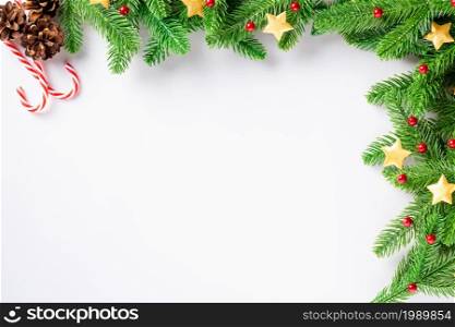 Christmas holiday background fir tree border branch, top view overhead festive Xmas decor studio shot isolated on white background, New year card concept