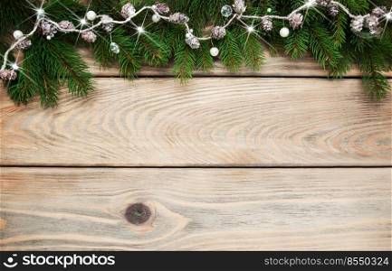 Christmas holiday background - tree  and decoration on a wooden table