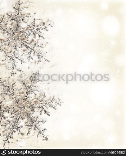 Christmas holiday background with big beautiful snowflake, Christmas tree ornament and decoration, beige card made of abstract blur bokeh magic lights, winter pattern, decorative border design