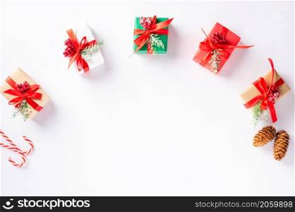 Christmas holiday composition gift boxes and decoration presents, Top view flat lay of Xmas ornament studio shot isolated on white background with copy space