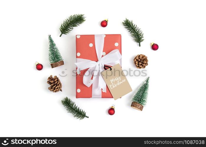 Christmas holiday composition with red gift box and tag decoration isolated on white background, new year and xmas or anniversary with presents in season, top view or flat lay.