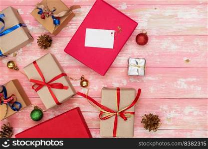 christmas holiday gift shopping background. view from above with copy space. craft paper present boxes tied from rope on blue background, top view. flat lay composition for birthday.