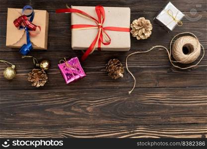 christmas holiday gift shopping background. view from above with copy space. craft paper present boxes tied from rope on blue background, top view. flat lay composition for birthday.