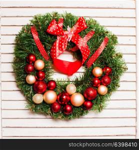 Christmas holiday wreath with red and gold balls. Christmas holiday wreath