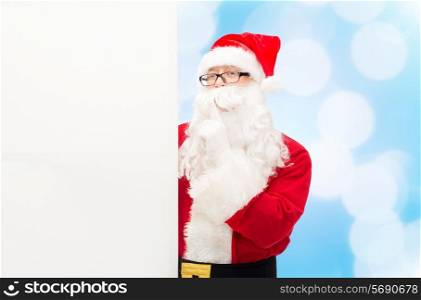christmas, holidays, advertisement and people concept - man in costume of santa claus with white blank billboard making hush gesture over blue lights background