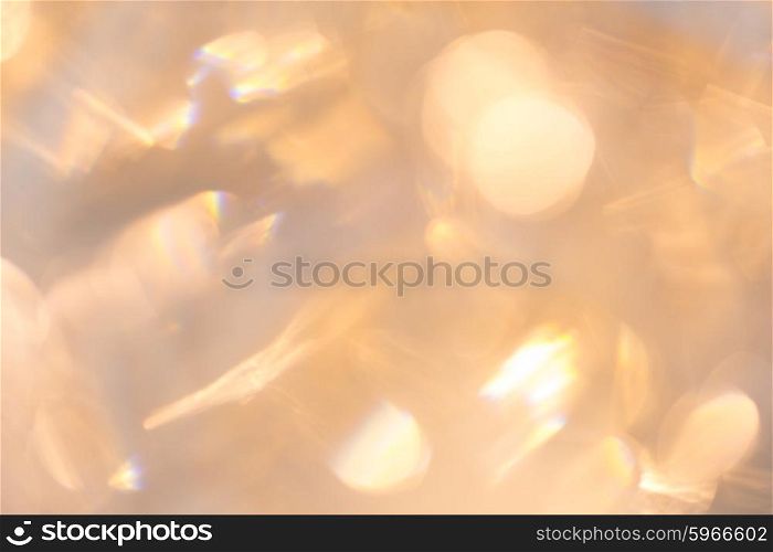 christmas, holidays and background concept - blurred beige holidays lights