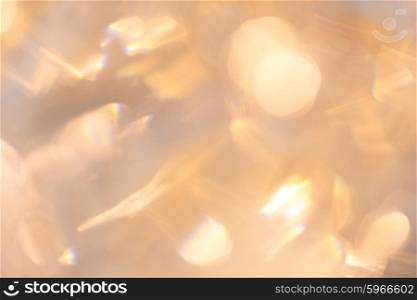 christmas, holidays and background concept - blurred beige holidays lights