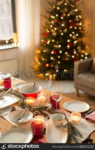 christmas, holidays and eating concept - table served for festive dinner at home. table served for christmas dinner at home