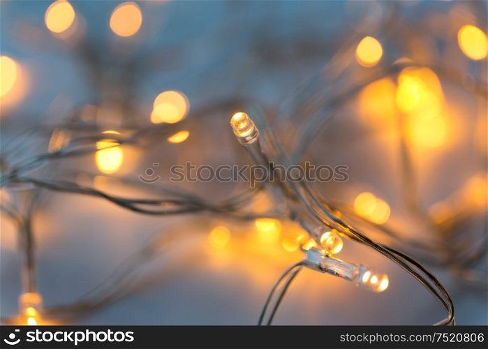 christmas, holidays and illumination concept - close up of electric garland lights. close up of electric garland lights