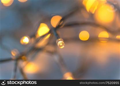 christmas, holidays and illumination concept - close up of electric garland lights. close up of electric garland lights