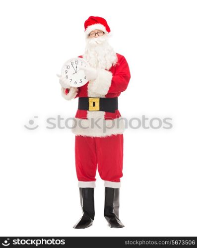 christmas, holidays and people concept - man in costume of santa claus with clock showing twelve pointing finger