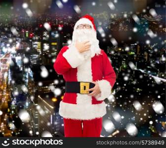 christmas, holidays and people concept - man in costume of santa claus over snowy night city background