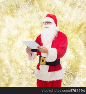 christmas, holidays and people concept - man in costume of santa claus with notepad over yellow lights background