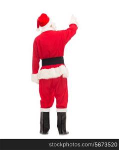 christmas, holidays and people concept - man in costume of santa claus pointing finger from back