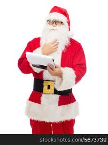 christmas, holidays and people concept - man in costume of santa claus with notepad