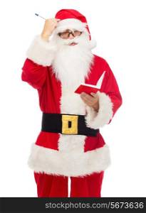 christmas, holidays and people concept - man in costume of santa claus with notepad and pen