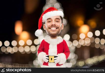 christmas, holidays and people concept - smiling man in santa claus costume over lights background (funny cartoon style character with big head). man in santa claus costume over christmas lights