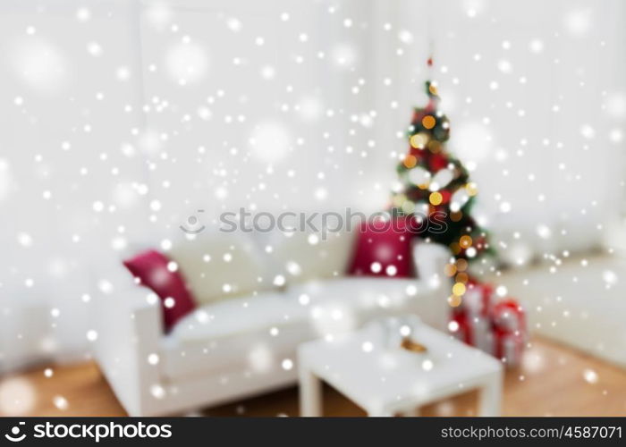 christmas, holidays, backdrop and interior concept - blurred living room with christmas tree background