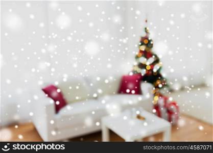 christmas, holidays, backdrop and interior concept - blurred living room with christmas tree background