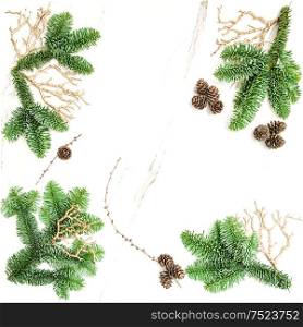Christmas holidays background. Pine branches with golden decoration. Flat lay