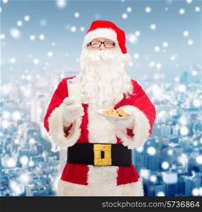 christmas, holidays, food, drink and people concept - man in costume of santa claus with glass of milk and cookies over snowy city background