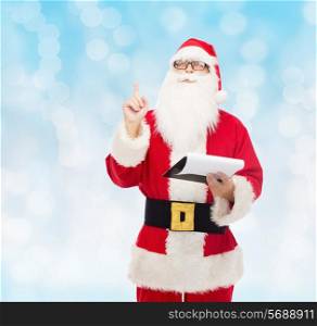 christmas, holidays, gesture and people concept - man in costume of santa claus with notepad pointing finger up over blue lights background