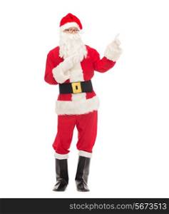 christmas, holidays, gesture and people concept - man in costume of santa claus pointing fingers