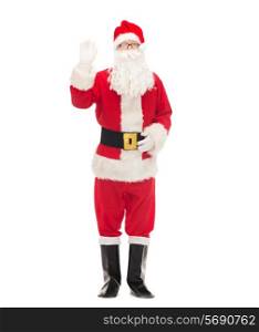 christmas, holidays, gesture and people concept - man in costume of santa claus waving hand