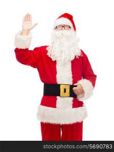 christmas, holidays, gesture and people concept - man in costume of santa claus waving hand