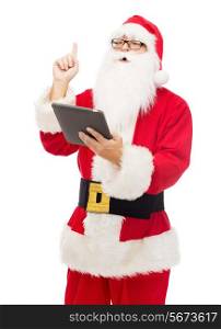 christmas, holidays, technology and people concept - man in costume of santa claus with tablet pc computer pointing finger up