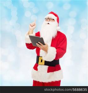 christmas, holidays, technology and people concept - man in costume of santa claus with tablet pc computer pointing finger up over blue lights background