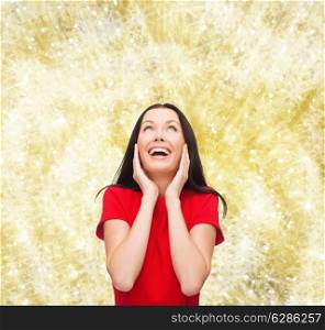 christmas, holidays, valentine&#39;s day, celebration and people concept - smiling woman in red dress over yellow background